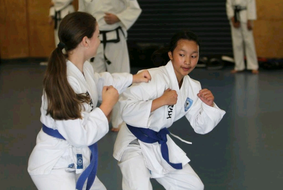 girls ducking and weaving taekwondo classes