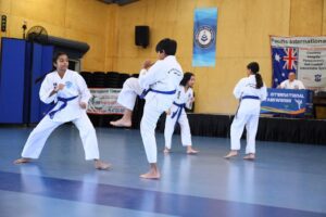 Teens Taekwondo classes, boy and girl sparring