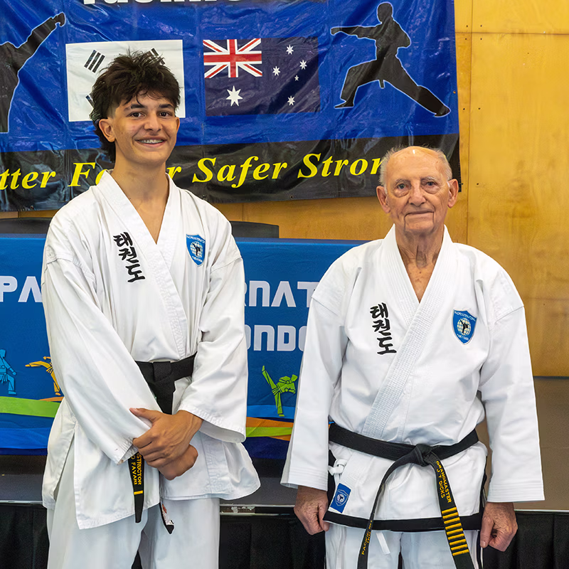 Grandmaster Dicks with Luciano Favari on achieving black belt Luciano Favari receiving black belt from Grandmaster Trevor Dicks at Pacific International Taekwondo