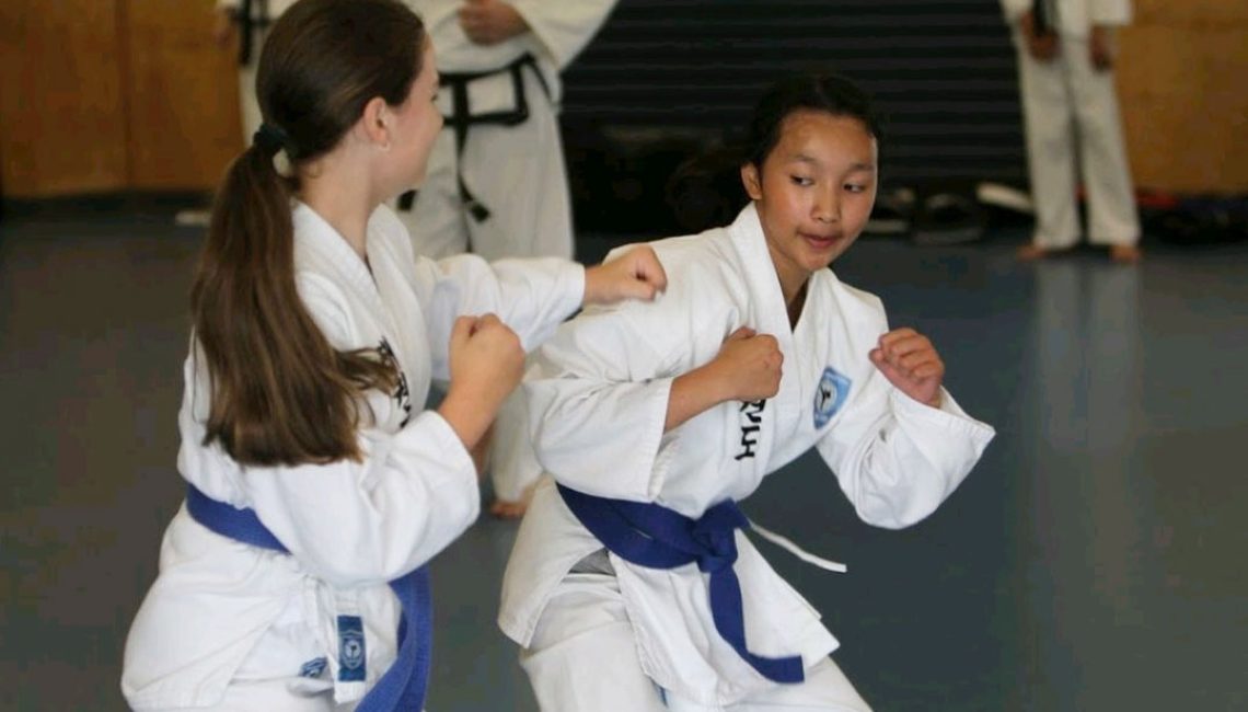 girls ducking and weaving taekwondo classes